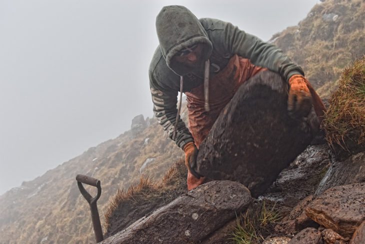 Scott moving boulders into place. Photo © Chris Puddephatt