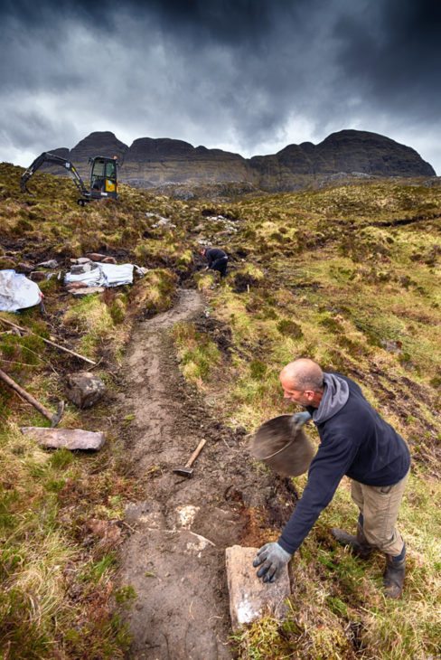 Mark finishing off the drop dressing on the path. Photo © Chris Puddephatt