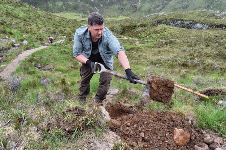 Joe busy digging out a hole for an additional step to go in. Photo © Chris Puddephatt.