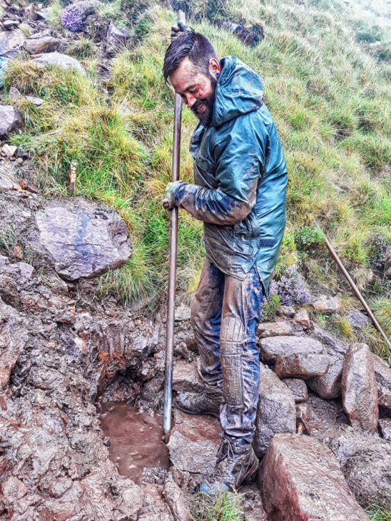 Xabi trying to find the bath plug while working on a cross drain. Photo © Chris Puddephatt.